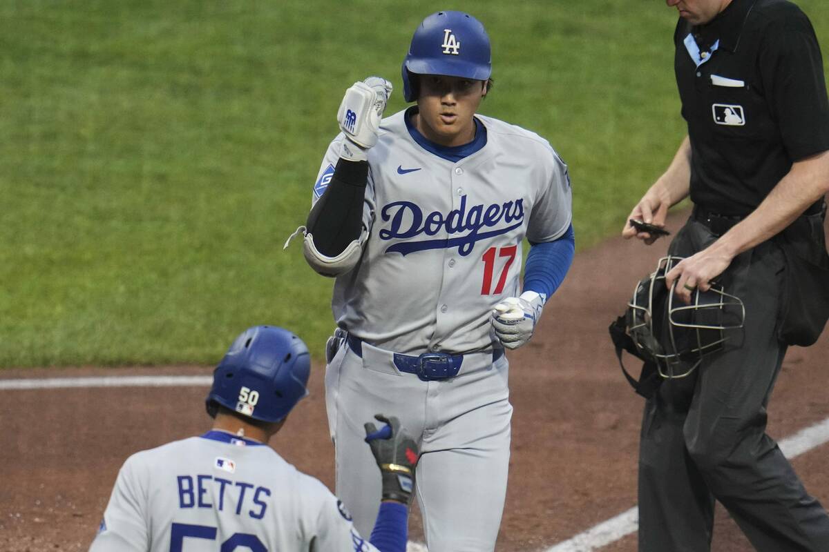 Los Angeles Dodgers' Shohei Ohtani (17) returns to the dugout after after hitting a solo h ...