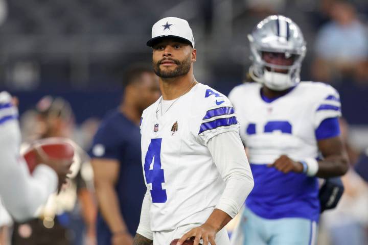Dallas Cowboys quarterback Dak Prescott (4) stands on the field before a preseason NFL football ...