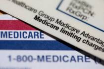 FILE - A Medicare Advantage PPO card rests on top of a Medicare card in Portland, Ore., June 10 ...