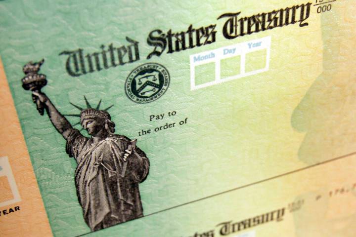 FILE - This May 8, 2008, file photo, shows blank checks on an idle press at the Philadelphia Re ...