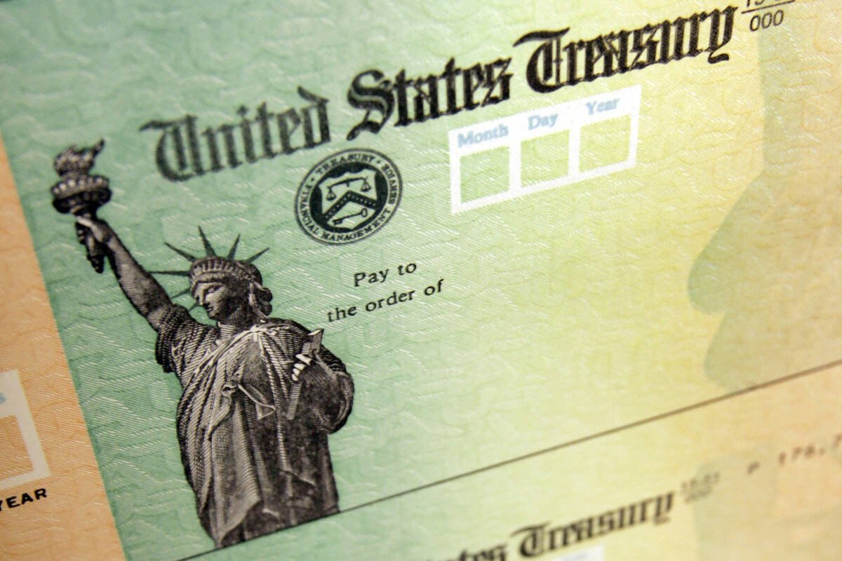 FILE - This May 8, 2008, file photo, shows blank checks on an idle press at the Philadelphia Re ...