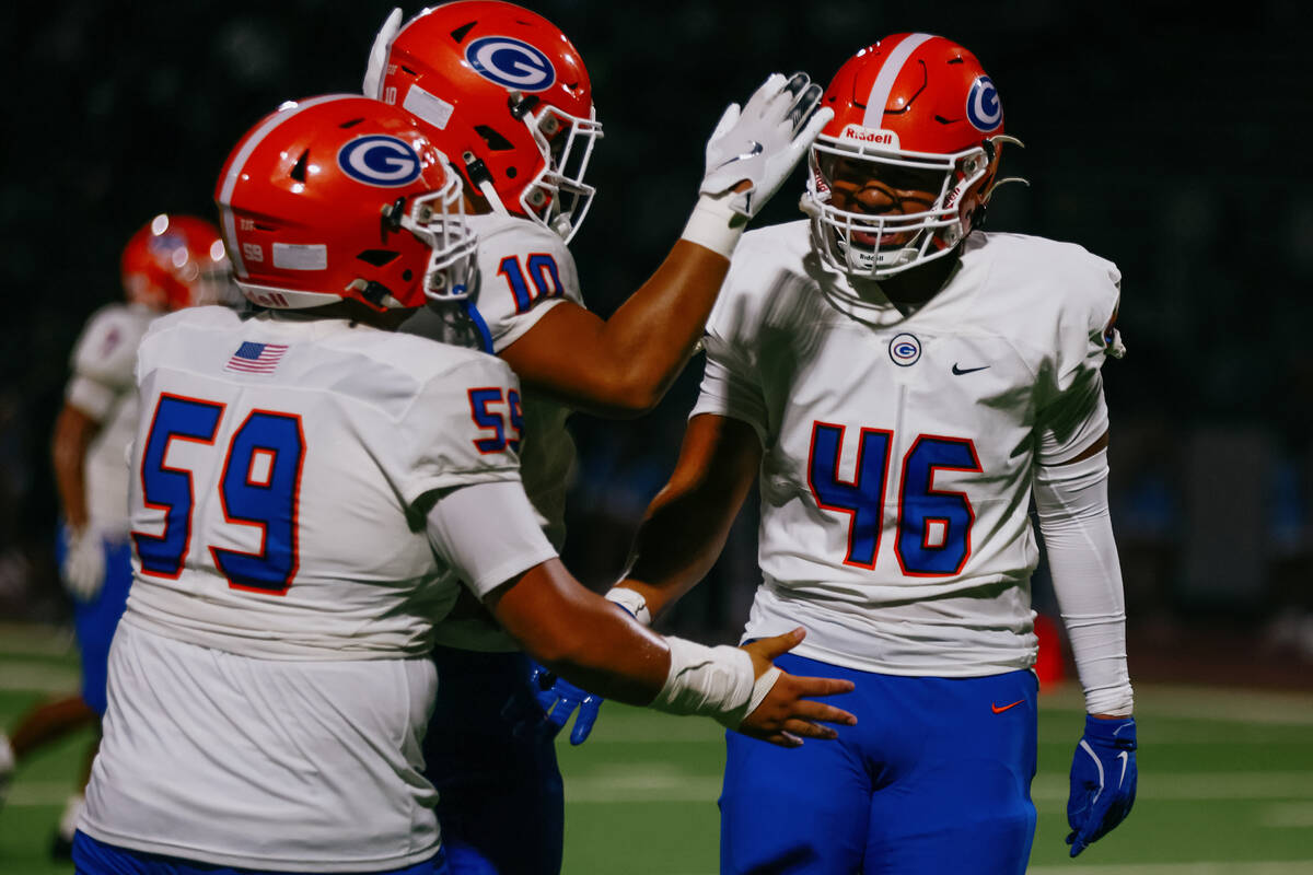 Bishop Gorman offensive lineman Treyton Savea (59) and middle linebacker Tamatoa Gaoteote (10) ...