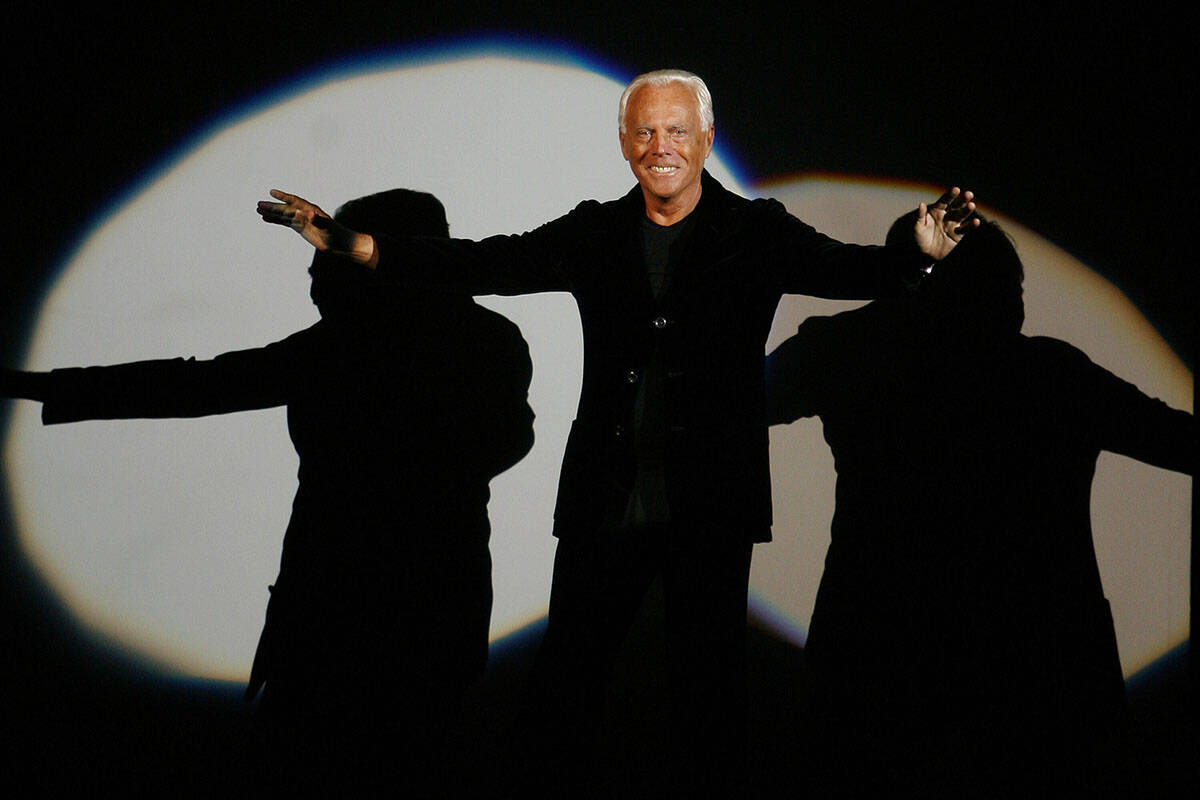 FILE - Giorgio Armani receives his share of applause after presenting his Emporio Fall-Winter 2 ...