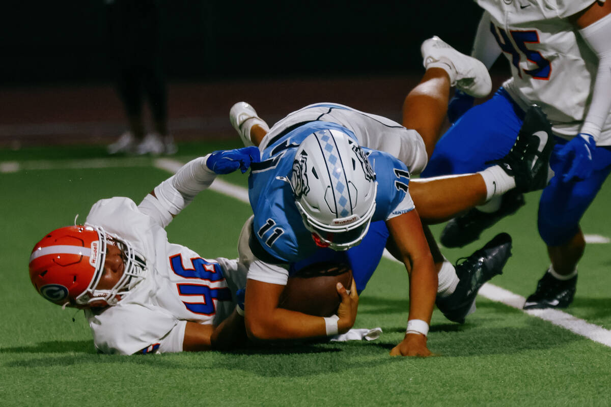 Bishop Gorman’s Caleb Lea’ea (46) sacks Centennial quarterback Oliver Bergstrom ( ...
