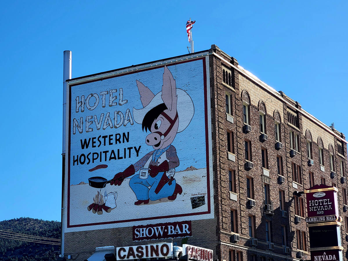 A mural on the side of Hotel Nevada, the tallest building in Nevada about 100 years ago, promis ...