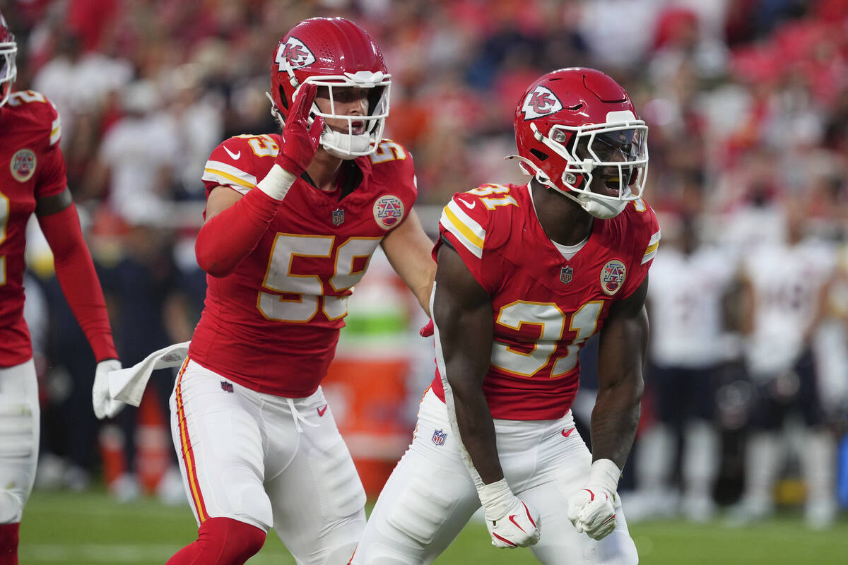 Kansas City Chiefs linebacker Jeffrey Bassa (31) celebrates with Kansas City Chiefs linebacker ...