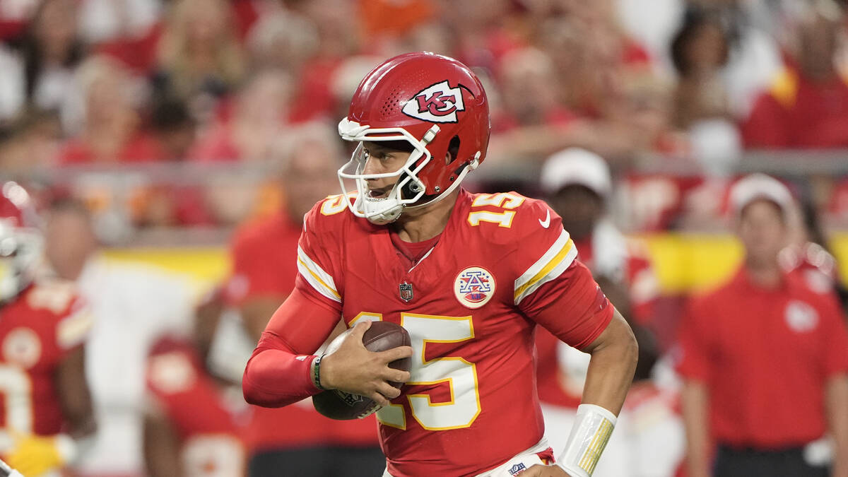 Kansas City Chiefs quarterback Patrick Mahomes runs the ball during the first half of an NFL pr ...