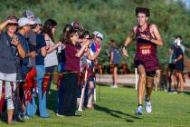 Faith Lutheran High School runner Brady Anderson (804) nears the finish to take first place in ...