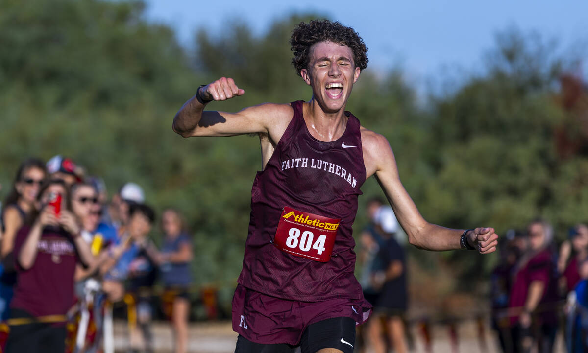 Faith Lutheran High School runner Brady Anderson (804) celebrates at the finish taking first pl ...