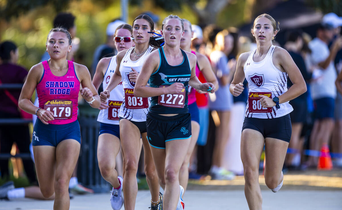 Variety A Girls competitors at the front of the race group navigate around the lake during the ...