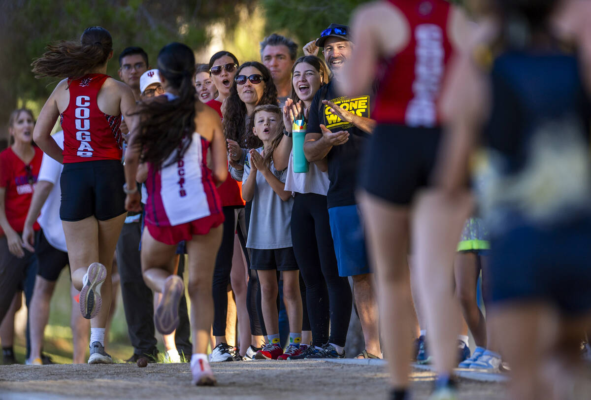 The crowd cheers for racers as the Variety A Girls navigate around the lake during the 55th Ann ...