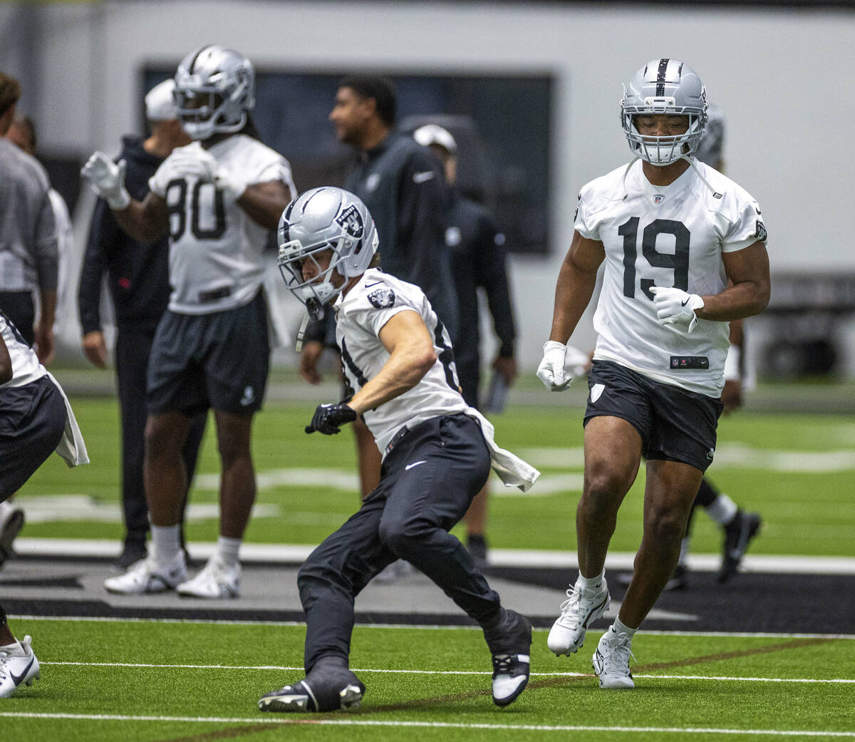 Raiders wide receiver Amari Cooper (19) runs sprints with teammates during practice at the Inte ...