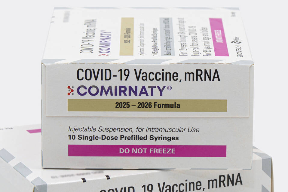 This photo provided by Pfizer in August 2025 shows boxes for the updated COVID-19 vaccine Comir ...