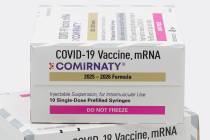 This photo provided by Pfizer in August 2025 shows boxes for the updated COVID-19 vaccine Comir ...