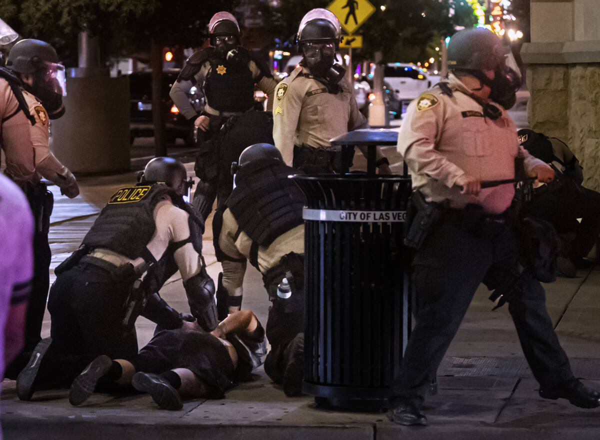 Las Vegas police arrest a protester on Wednesday, June 11, 2025, in downtown Las Vegas. (Chase ...