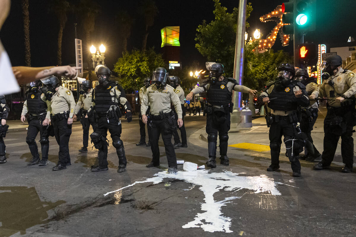 Las Vegas police advance against ICE protesters on Wednesday, June 11, 2025, in downtown Las Ve ...