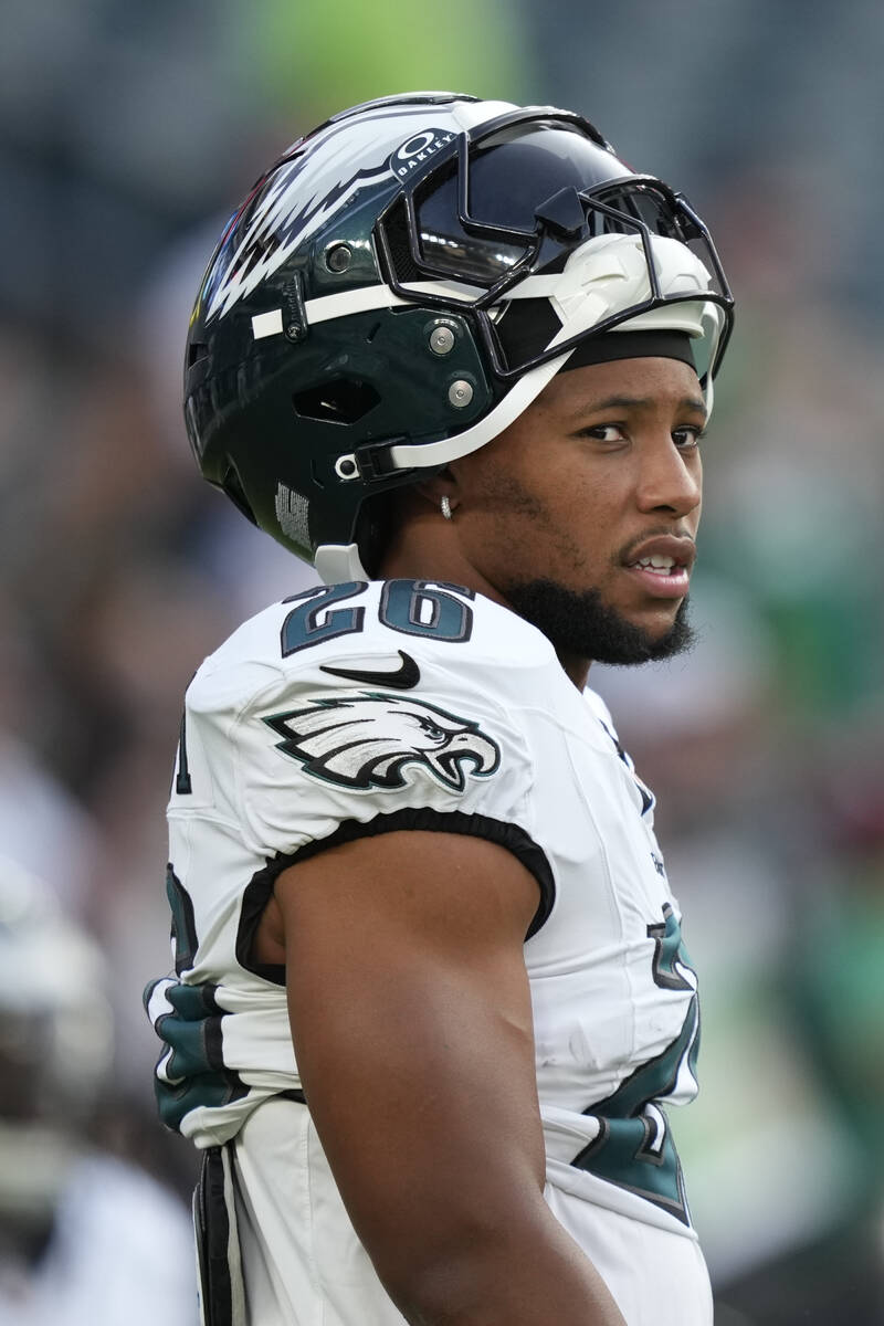 Philadelphia Eagles' Saquon Barkley warms up before an NFL preseason football game Thursda ...