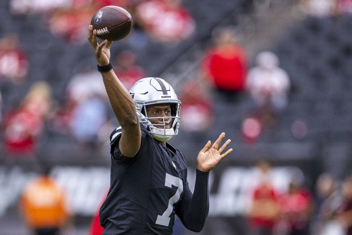 Raiders quarterback Geno Smith (7) gets off a pass during warm ups of their pre-season NFL game ...