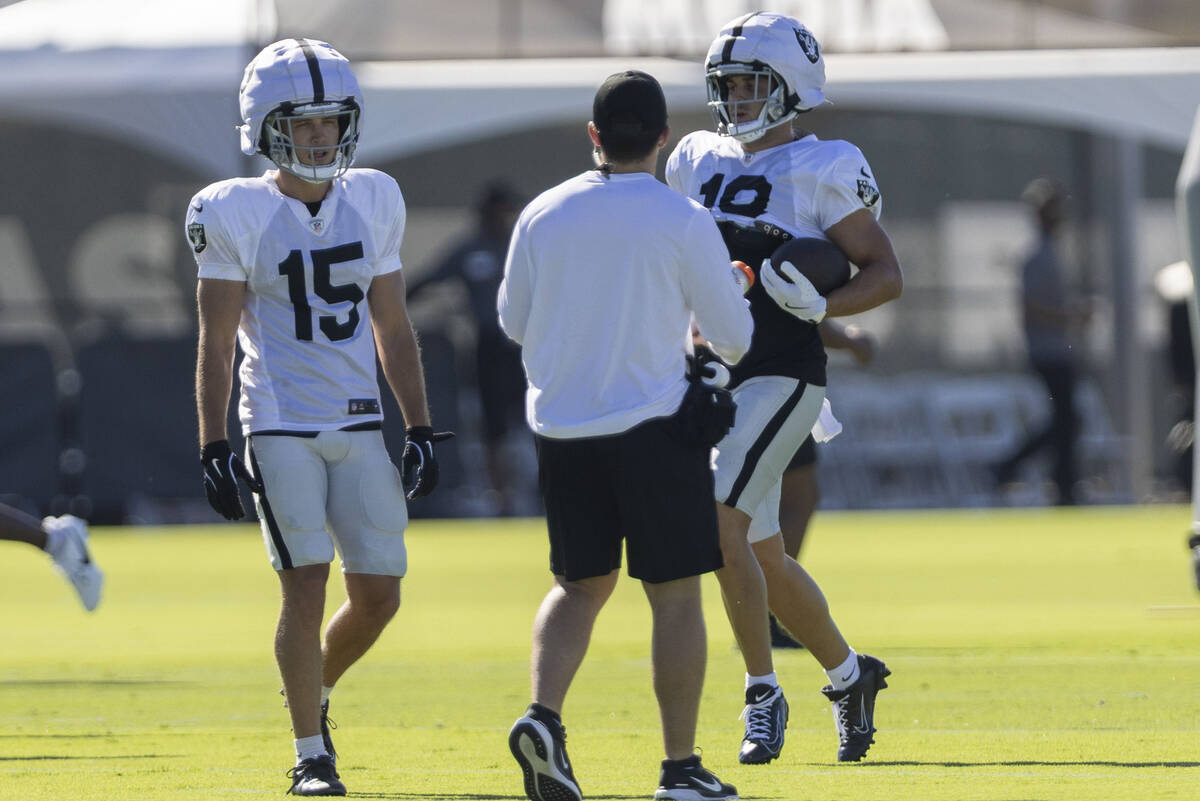 Raiders wide receiver Jack Bech (18) runs near wide receiver Kyle Philips (15) after making a c ...