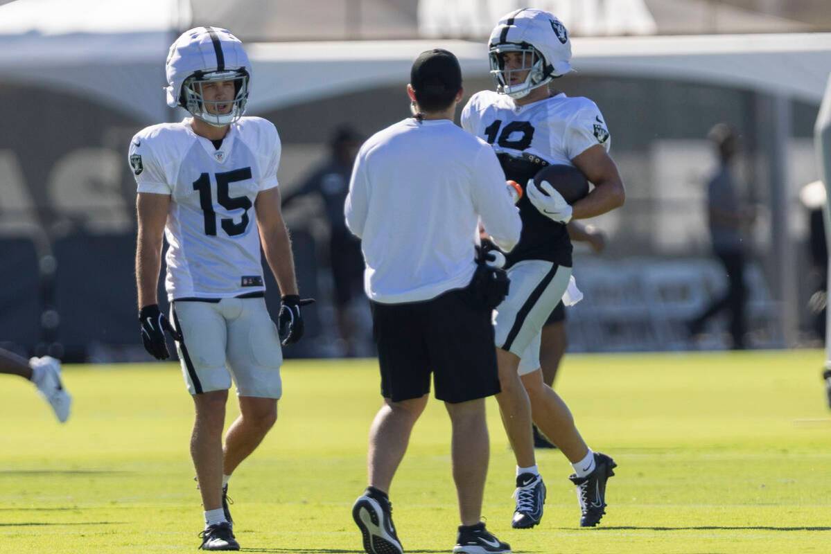 Raiders wide receiver Jack Bech (18) runs near wide receiver Kyle Philips (15) after making a c ...