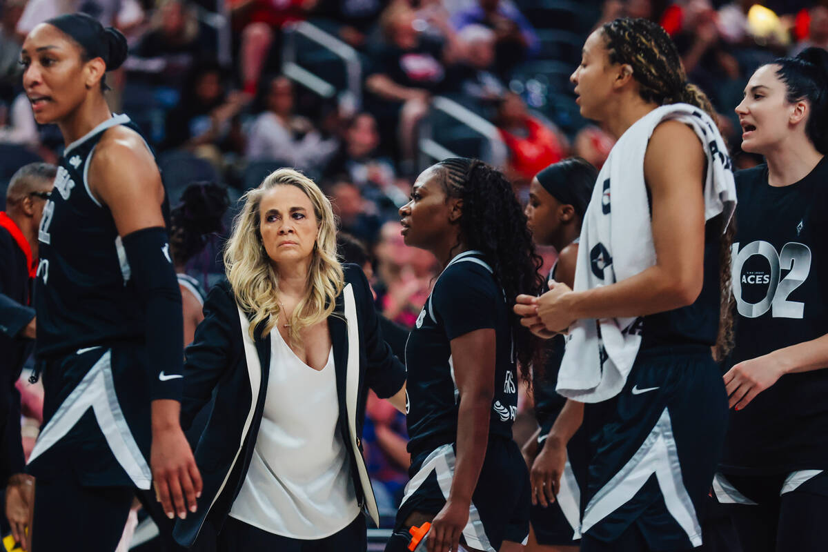 Aces head coach Becky Hammon gathers her players during a WNBA basketball game between the Aces ...
