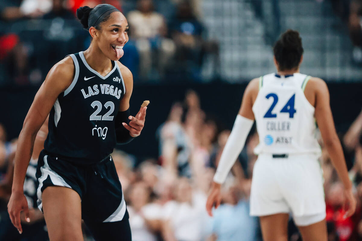 Aces center A'ja Wilson celebrates a 3-point shot during a WNBA basketball game between the Ace ...