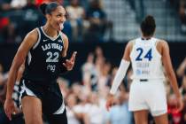 Aces center A'ja Wilson celebrates a three point shot during a WNBA basketball game betwee ...