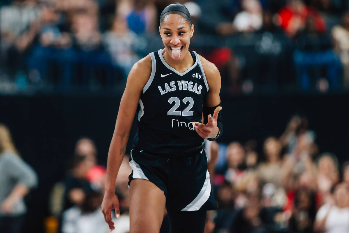 Aces center A'ja Wilson celebrates a 3-point shot during a WNBA basketball game between the Ace ...