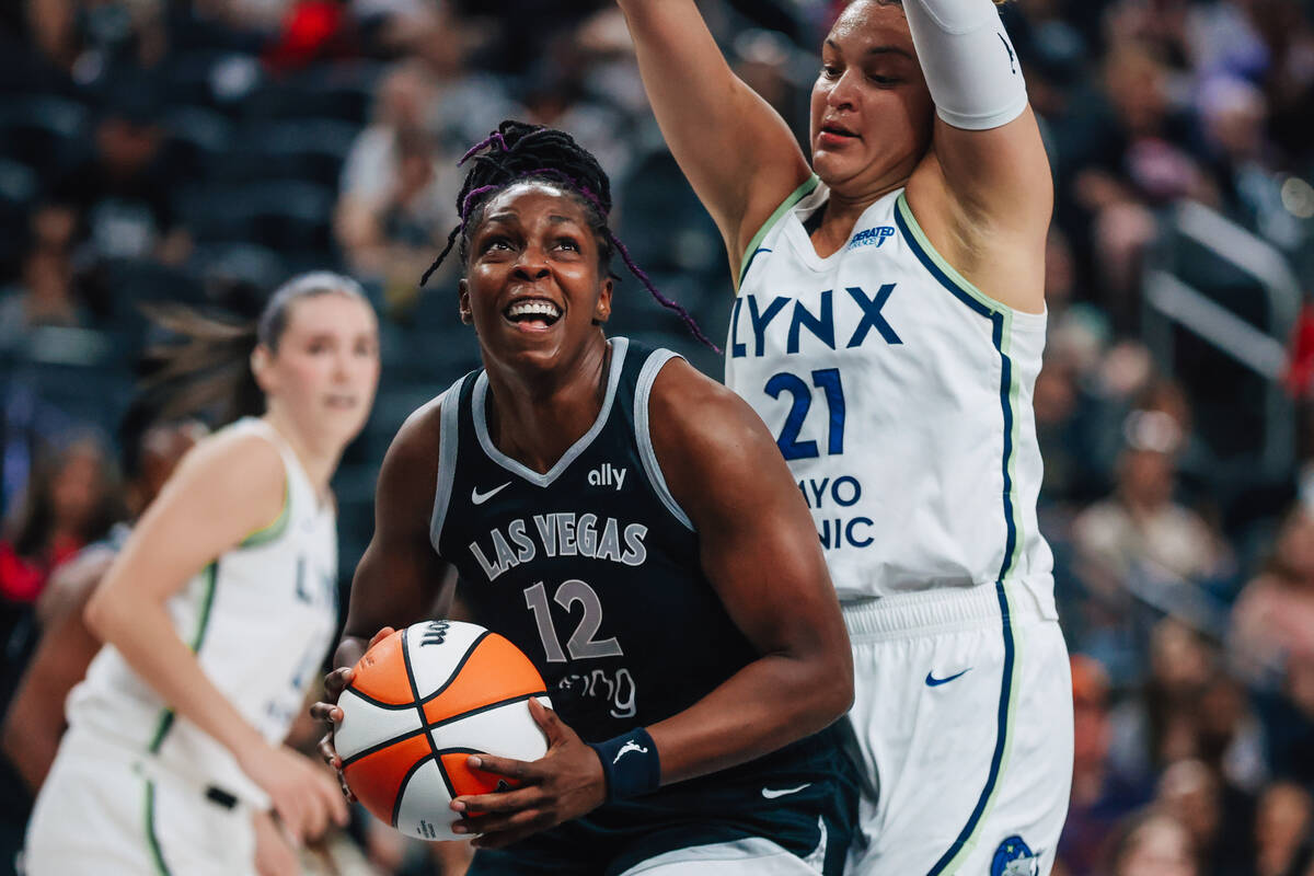 Aces guard Chelsea Gray (12) searches for the net as Minnesota Lynx guard Kayla McBride (21) de ...