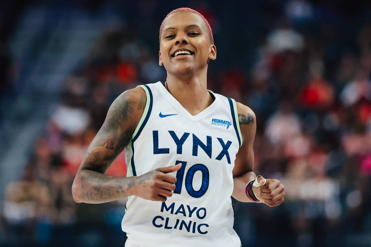 Minnesota Lynx guard Courtney Williams (10) smiles as she runs down court during a WNBA basketb ...