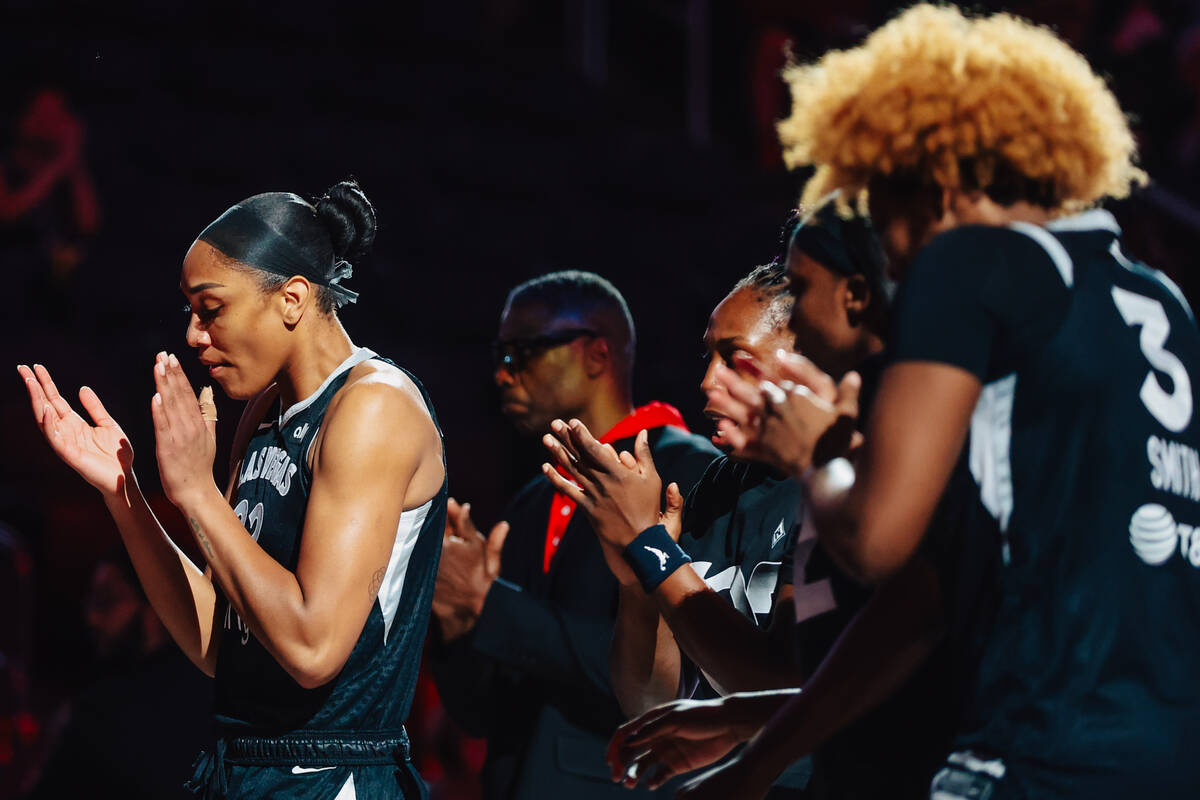 Aces center A'ja Wilson claps during a WNBA basketball game between the Aces and Minnesota ...