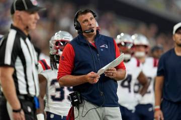 New England Patriots head coach Mike Vrabel watches from the sidelines during the first half of ...