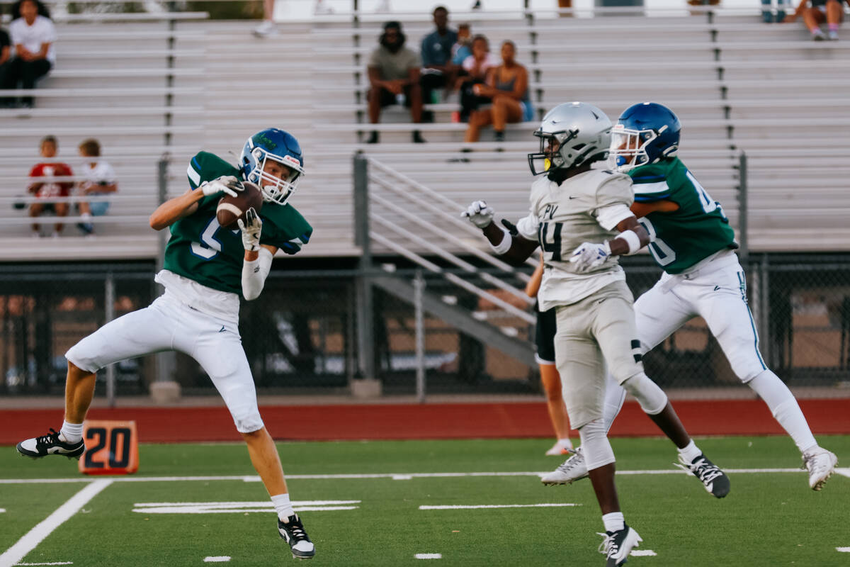 Green Valley defensive back Sam Byington (5) intercepts a pass intended for Palo Verde wide rec ...