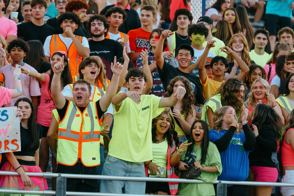 The Green Valley student section reacts to an interception that was called back due to a flag o ...