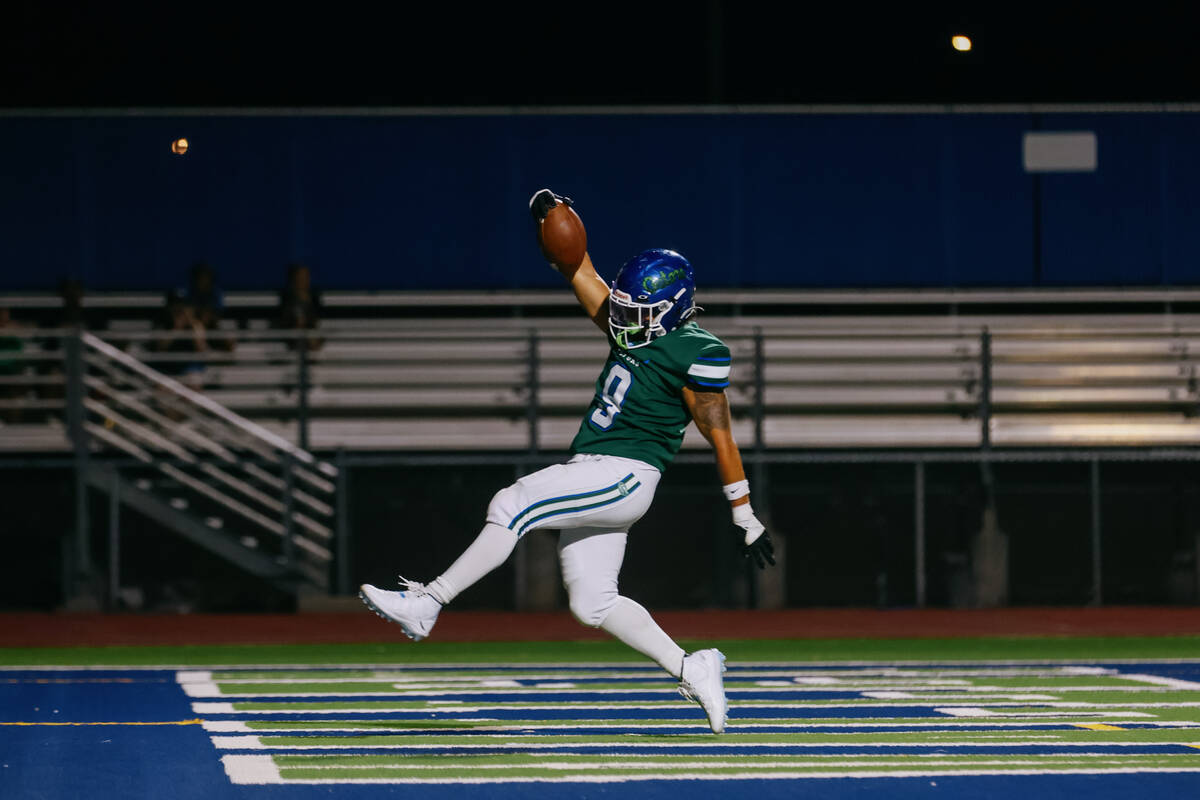 Green Valley running back Eliseo Gerardo (9) celebrates making a touchdown during the football ...