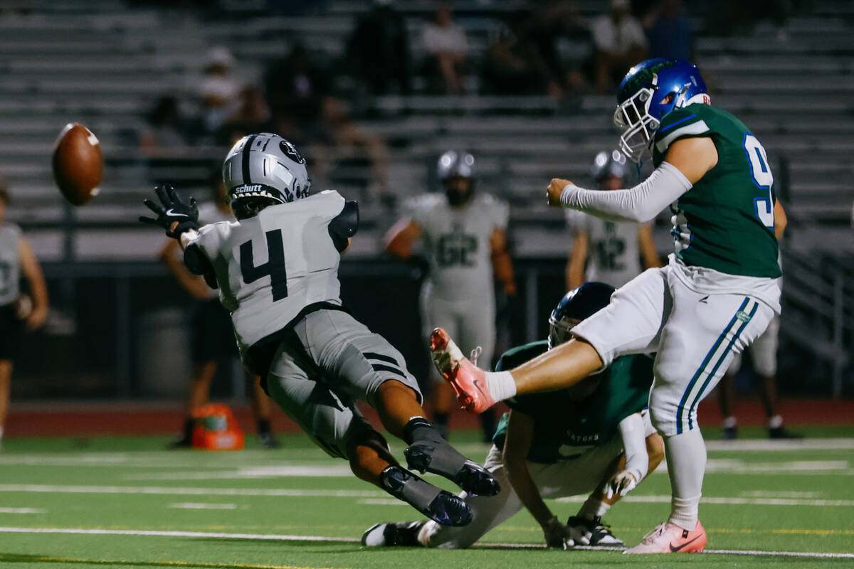 Green Valley kicker Raedon Michaels (99) kicks for an extra point as Palo Verde wide receiver B ...