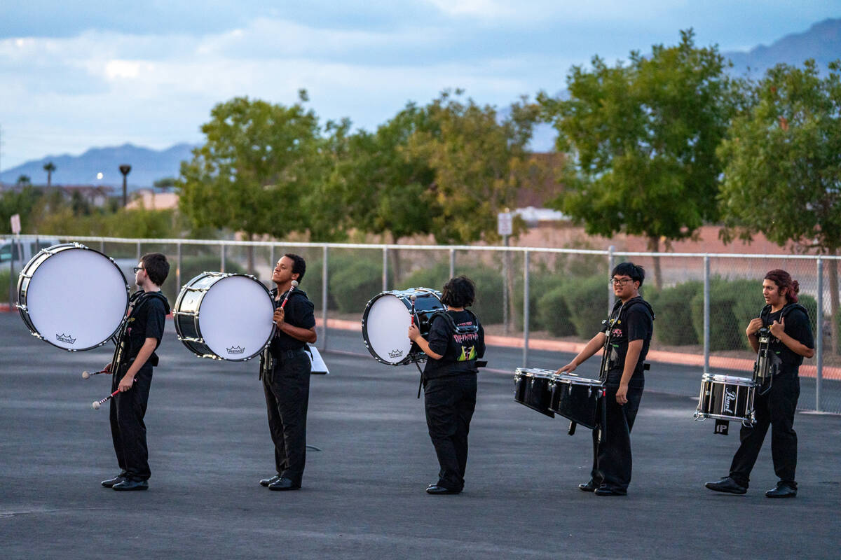 The marching band lines up before their halftime performance during a football game between Los ...