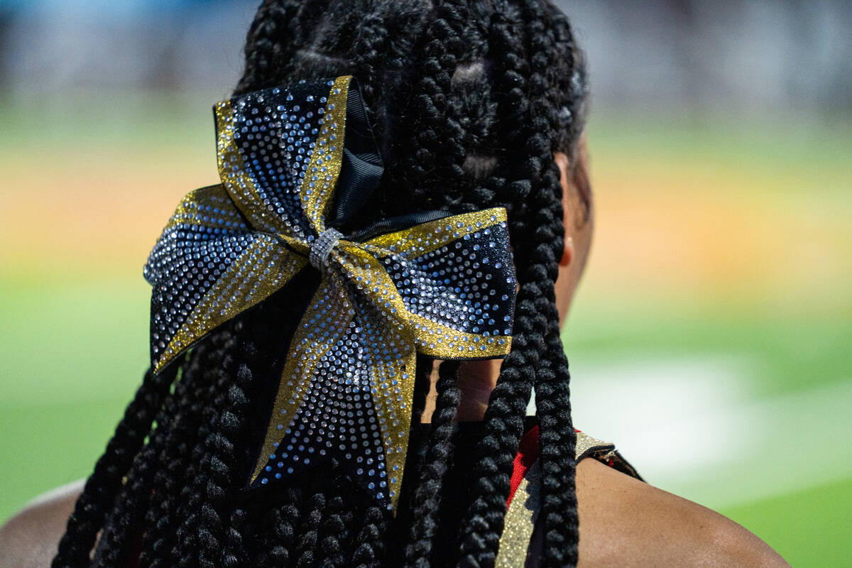 A Losee cheerleader’s bow is worn during a football game against Losee at Somerset Acade ...