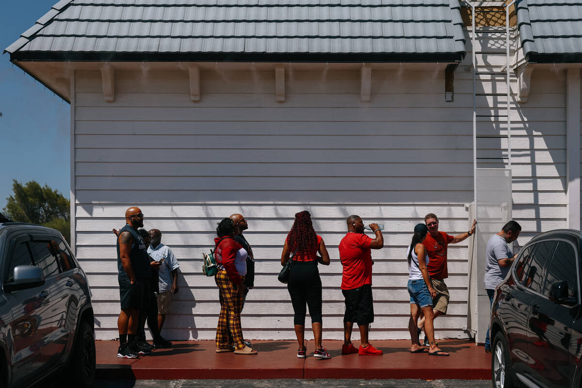 People stand in line to purchase lottery tickets on Saturday, Aug. 30, 2025 at The Lotto Store ...