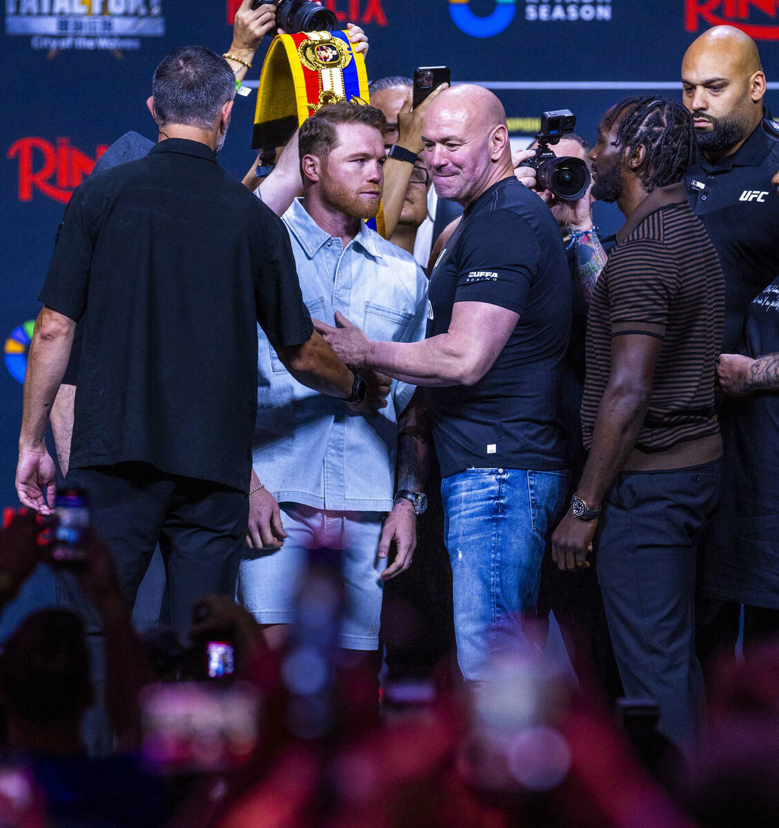 Canelo Alvarez and Terence Crawford face off as Dana White steps in to keep them apart during a ...