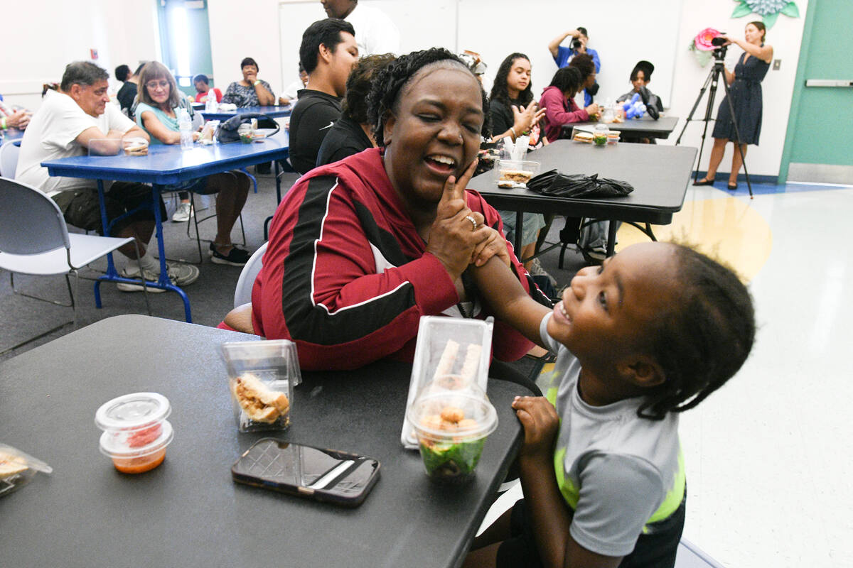 Zanovia Price plays with her grandson Onyx Wills during an event to celebrate Grandparent’s D ...