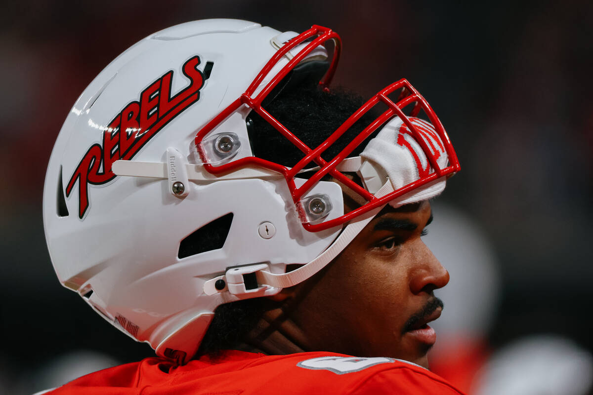 UNLV offensive lineman Ace Robinson (65) stands on the sidelines during the first half of the f ...