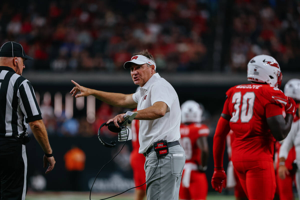 UNLV head coach Dan Mullen talks with the referee during second half of the football game on Sa ...