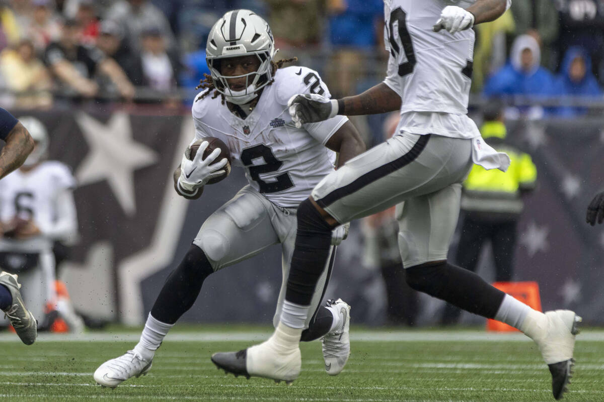 Raiders running back Ashton Jeanty (2) rushes with the football against the New England Patriot ...