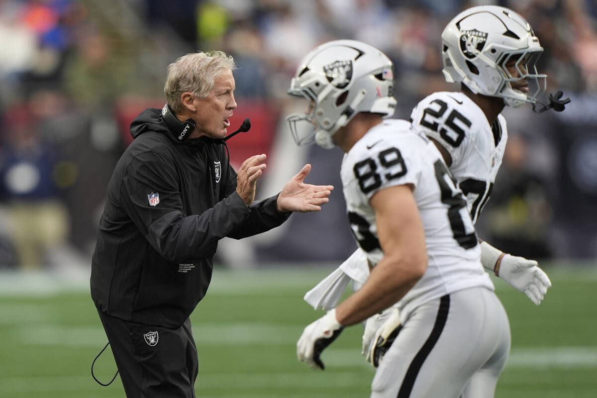 Las Vegas Raiders head coach Pete Carroll cheers on his team during the first half of an NFL fo ...