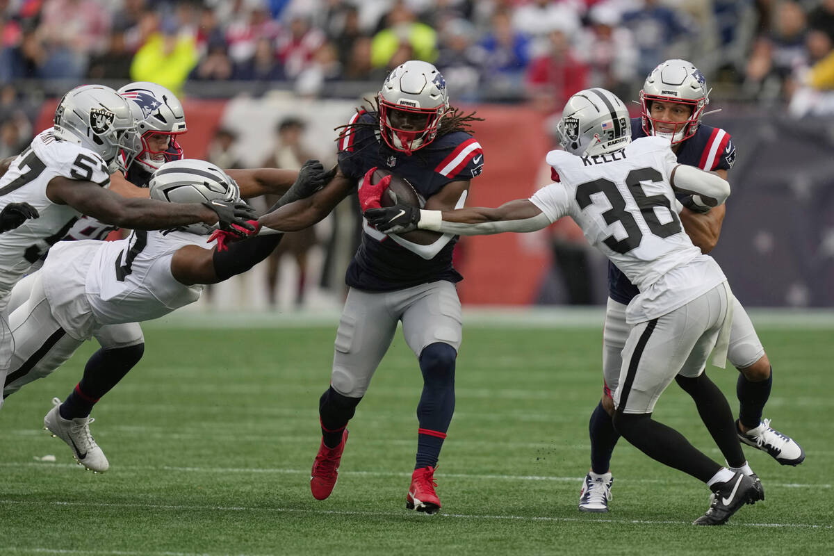 New England Patriots running back Rhamondre Stevenson (38) runs against the Las Vegas Raiders d ...