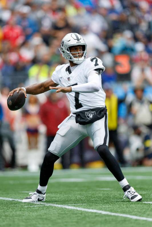 Las Vegas Raiders quarterback Geno Smith (7) drops back to make a pass during the first half of ...