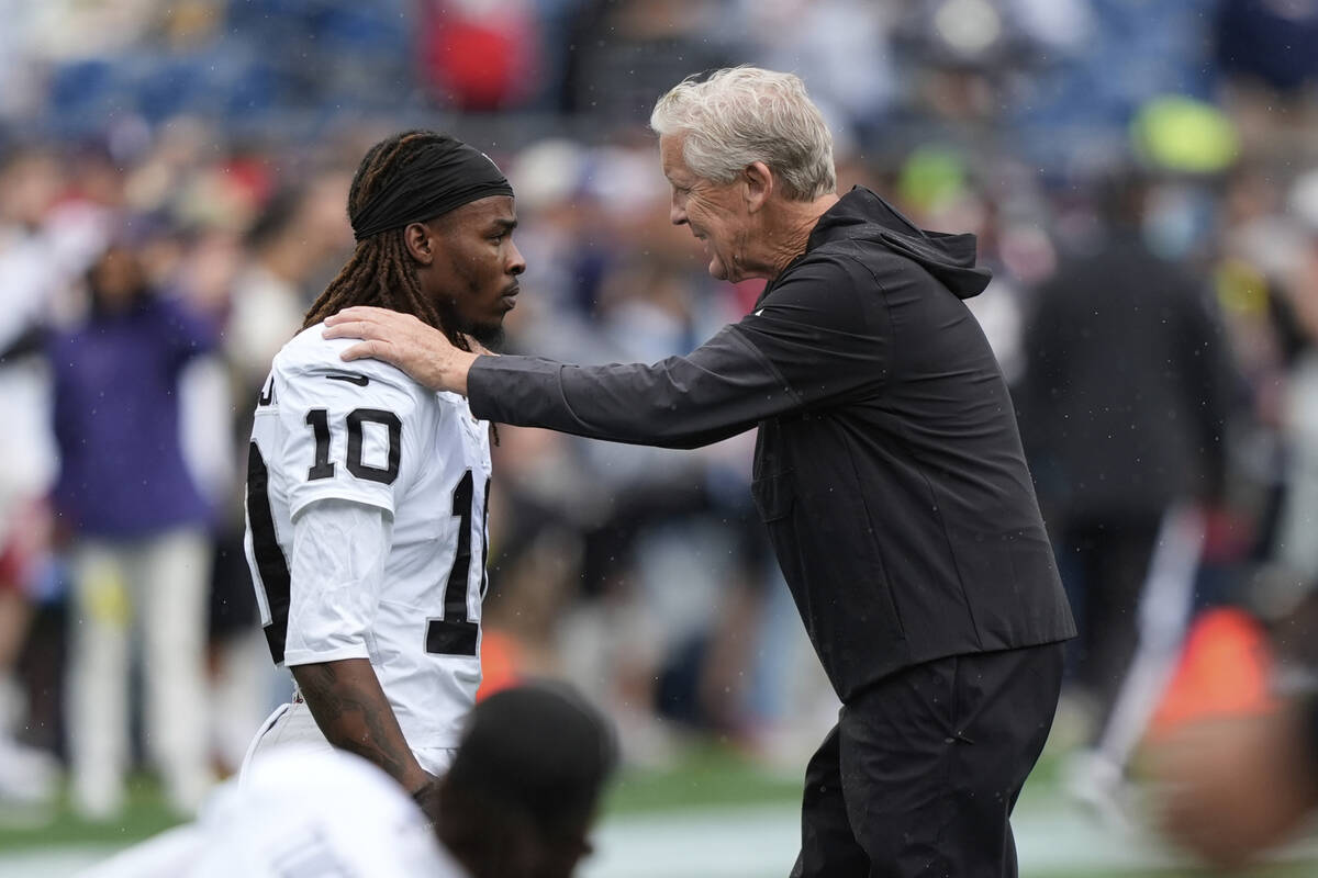 Las Vegas Raiders head coach Pete Carroll, right, speaks with Las Vegas Raiders wide receiver D ...
