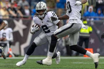 Raiders running back Ashton Jeanty (2) rushes with the football against the New England Patriot ...