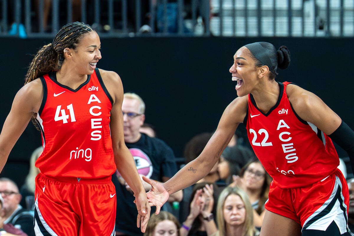 Aces Center Kiah Stokes (41) and Aces Center A'ja Wilson (22) celebrate after a play during a b ...